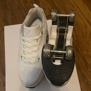 White Roller Shoes with Wheels; Fully retractable Like New condition.